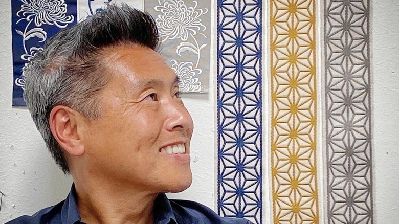 Vern Yip surrounded by decorative trims