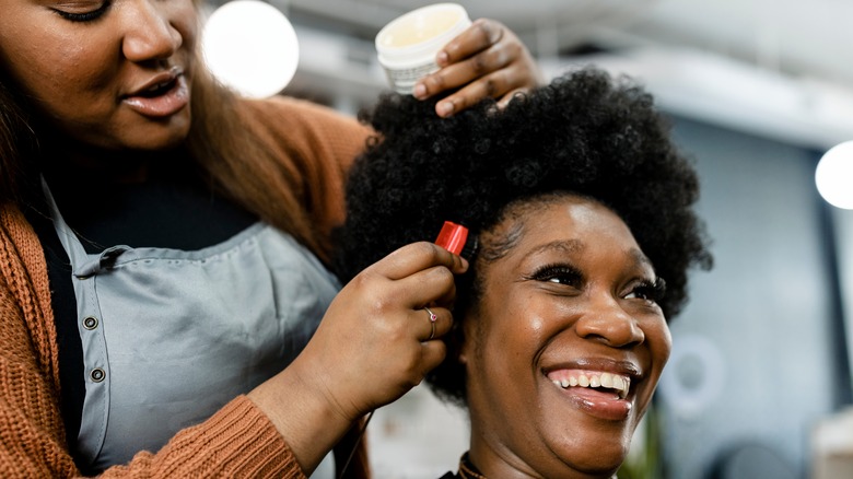 woman getting her hair done