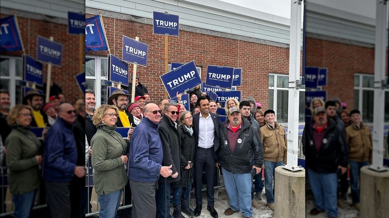 Vivek Ramaswamy with Trump supporters outside buildling