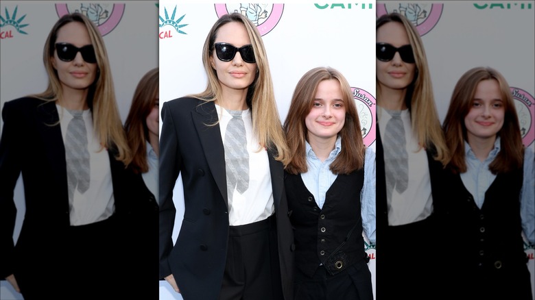 Angelina Jolie and Vivienne Jolie-Pitt posting at a red carpet event