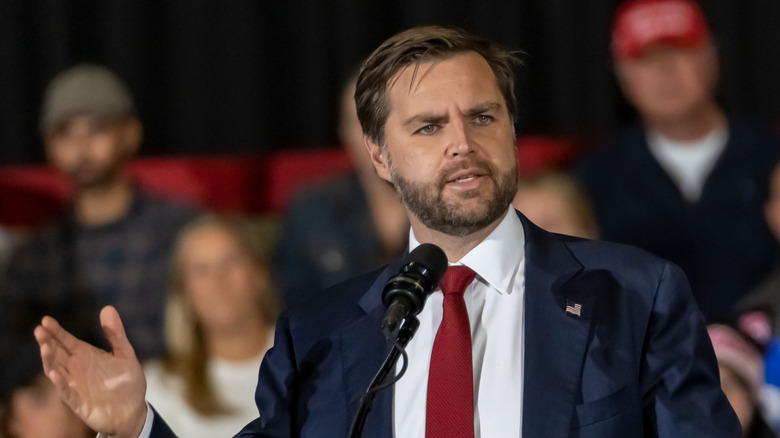 JD Vance speaking into a microphone at an event