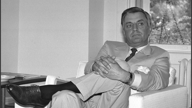 Walter Mondale in younger days in suit with legs crossed