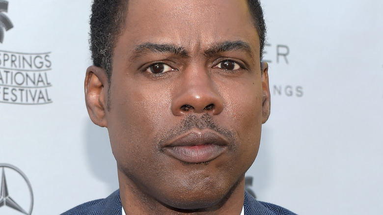 Chris Rock poses on the red carpet