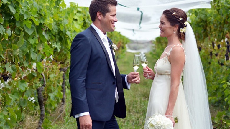 bride and groom in vineyard