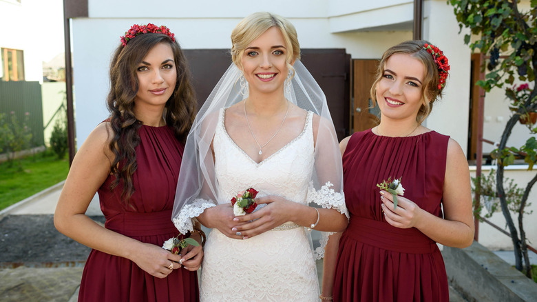 Bride and bridesmaids in burgundy