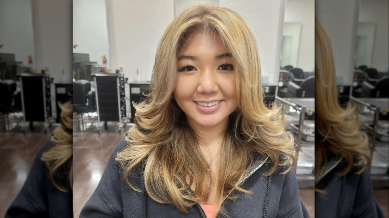 Woman smiling with layered haircut