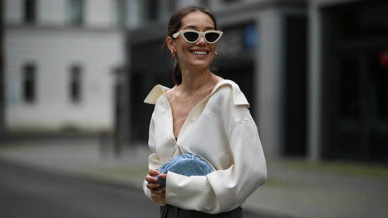 Woman smiling over shoulder