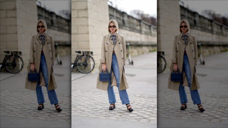 Woman wearing trench coat and scarf