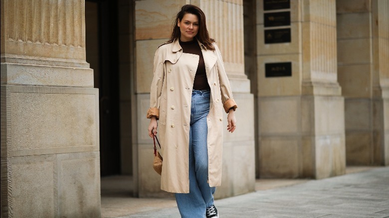 Woman in jeans and trench