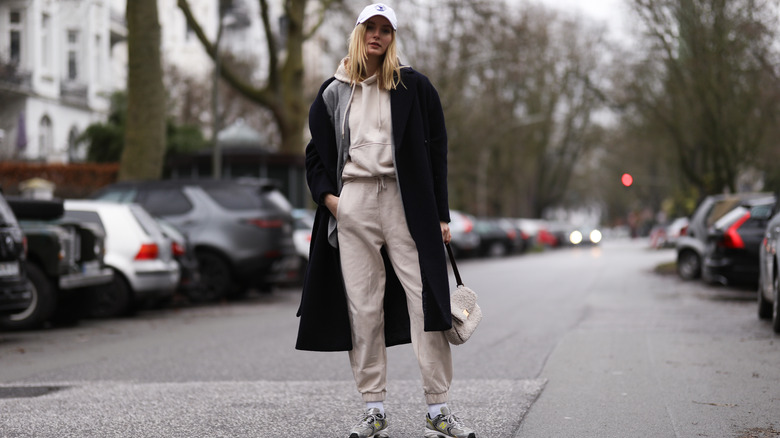 Woman in beige tracksuit