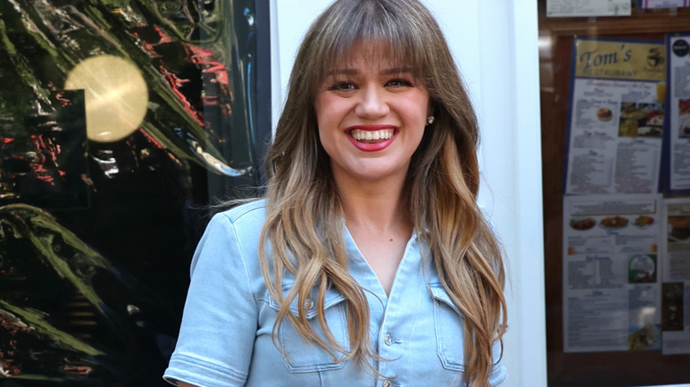 Kelly Clarkson wearing a denim jumpsuit at Tom's Restaurant in New York City in September 2024