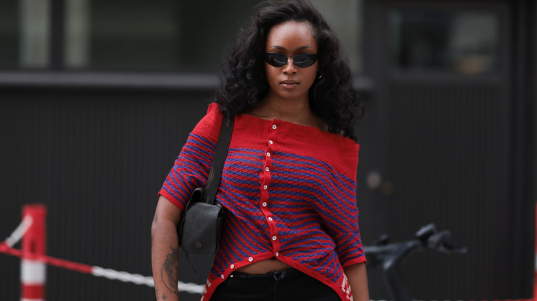 Woman wearing an off-the-shoulder sweater