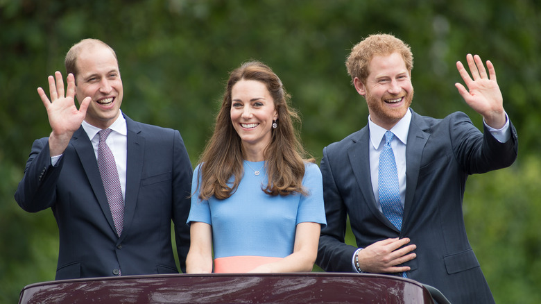 Prince william, kate middleton, and prince harry smiling