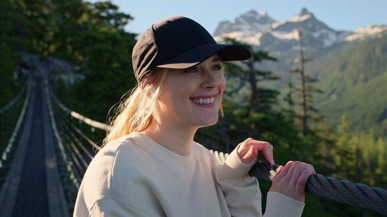 Alexandra Breckenridge (Mel) smiling in production still of "Virgin River"