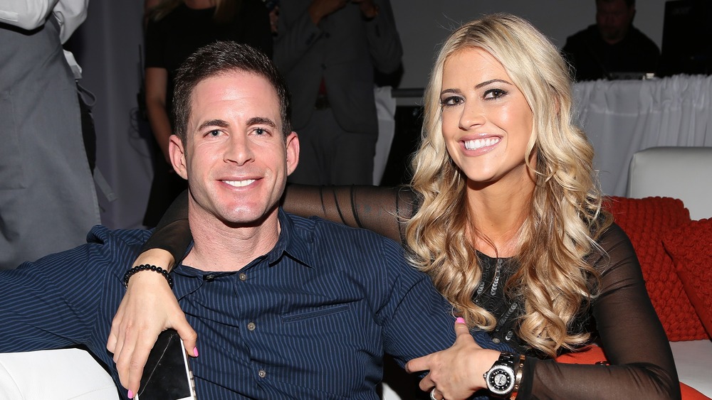 Christina Haack and Tarek El Moussa sitting on a couch