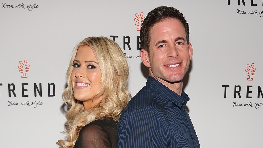 Christina Haack and Tarek El Moussa standing back-to-back