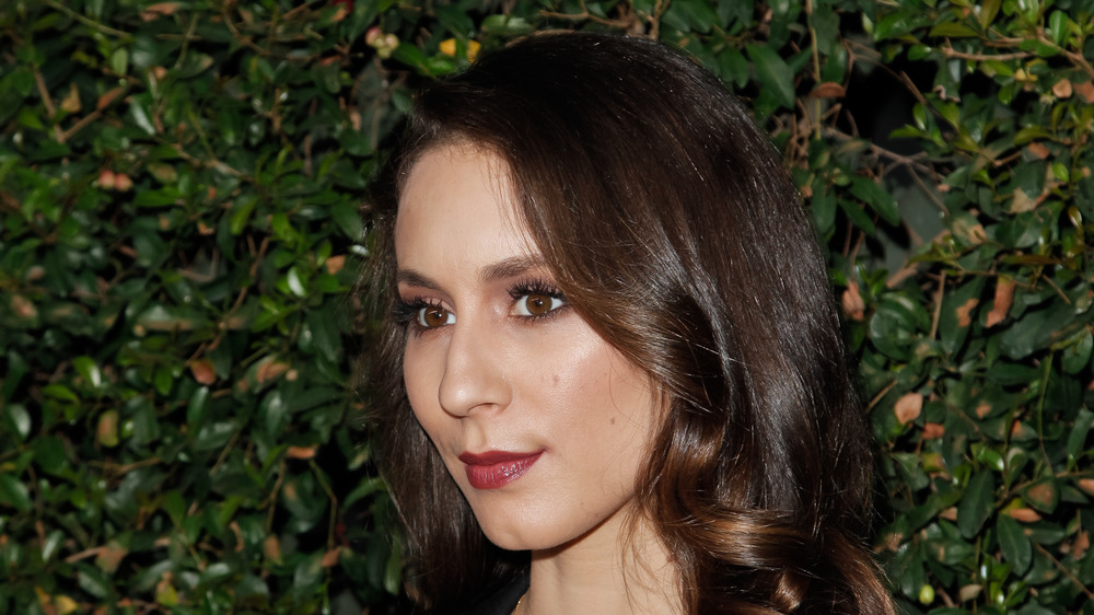 Troian Bellisario posing