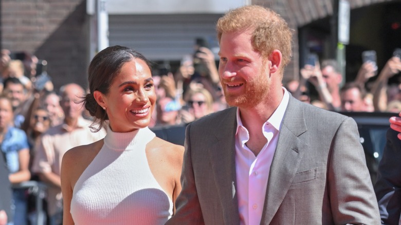 Meghan Markle smiling at Prince Harry