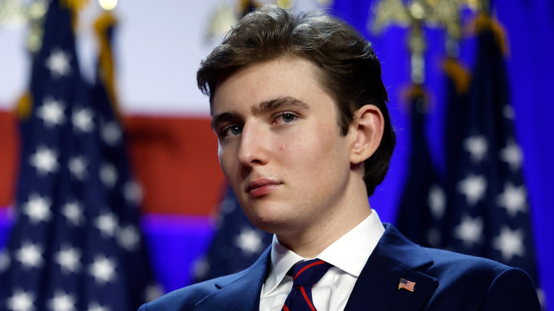 Barron Trump with an unreadable look on his face at an election night event