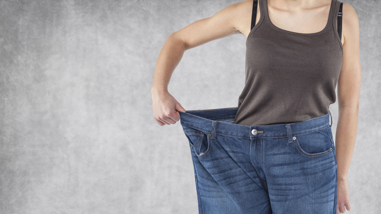 Woman in baggy jeans