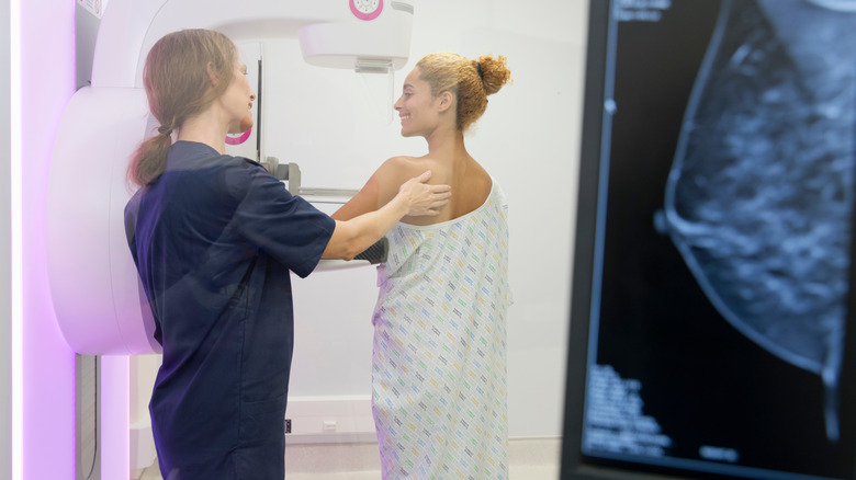 Woman being prepped for a mammogram
