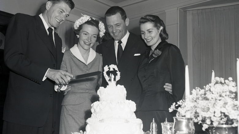 Ronald and Nancy Reagan cutting wedding cake