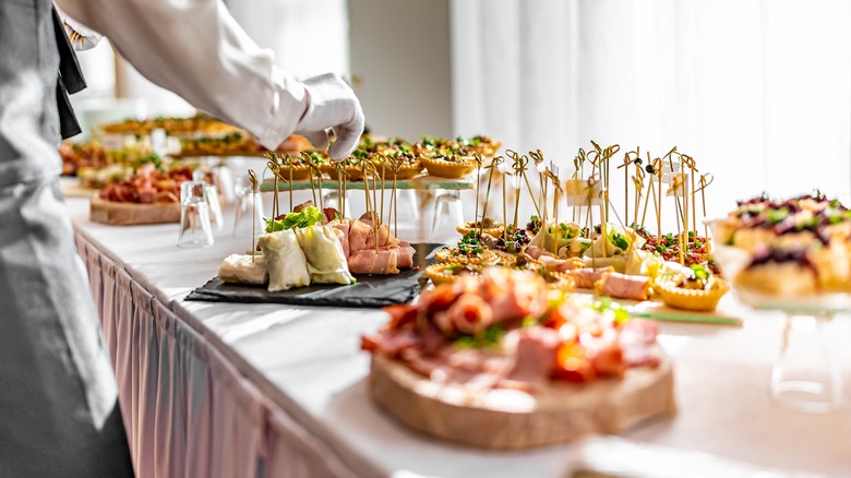 A wedding buffet table filled with food