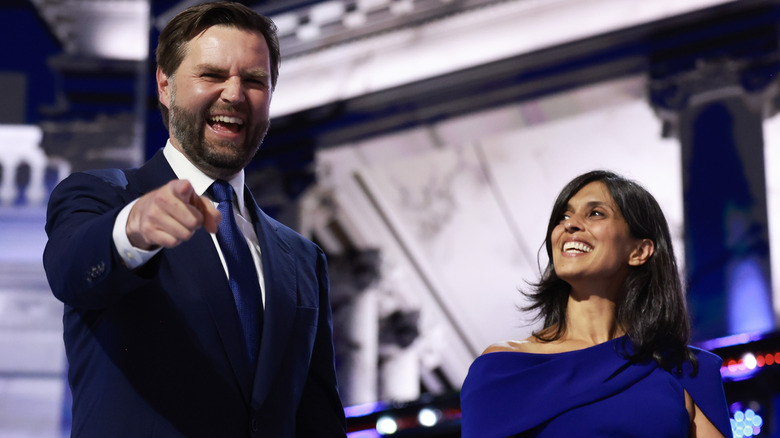 JD Vance pointing and laughing next to wife