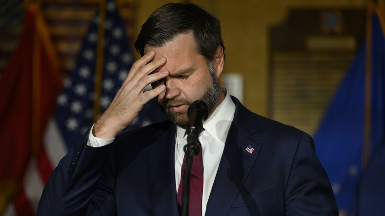 JD Vance with hand on head