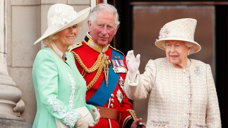 Camilla, Prince Charles and the queen waving