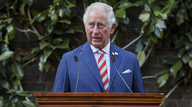 Prince Charles speaking into a mic