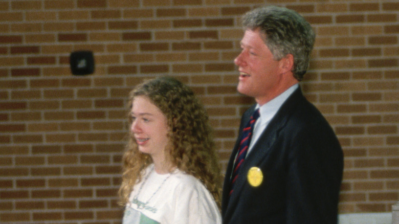 Chelsea and Bill Clinton smiling