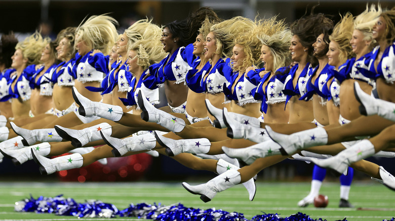 Cowboys cheerleaders performing on game day 