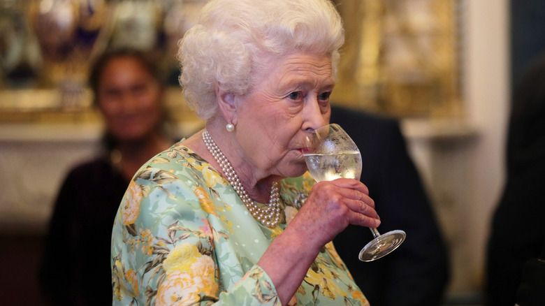 Queen Elizabeth sips wine