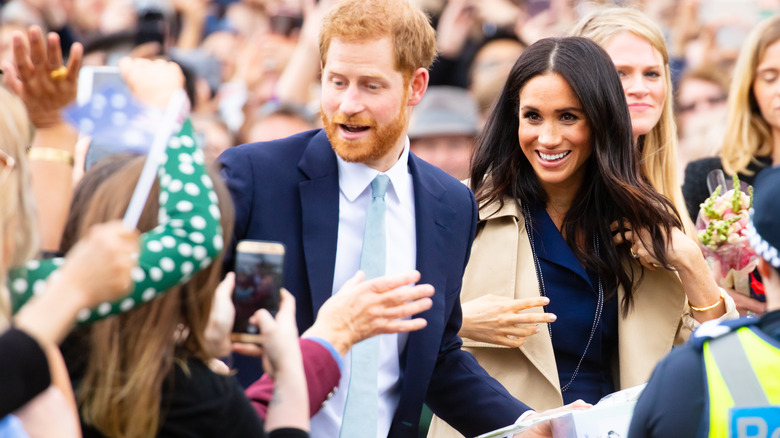 Harry and Meghan in a crowd