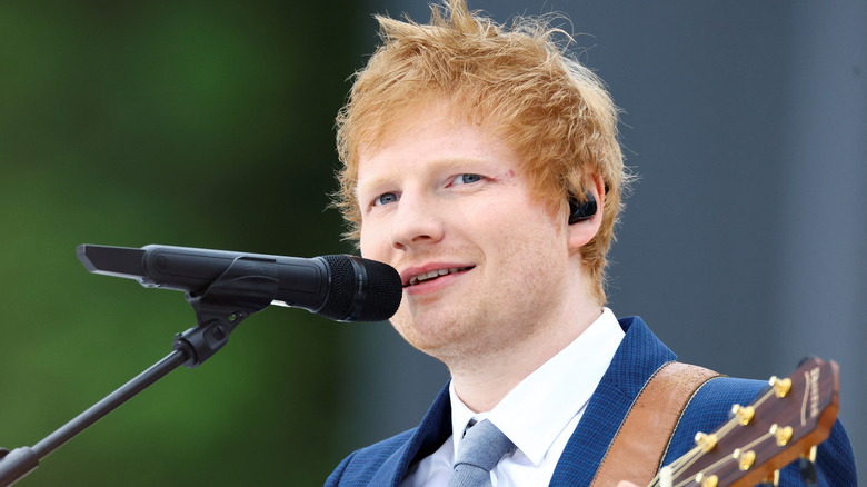 Ed Sheeran plays guitar