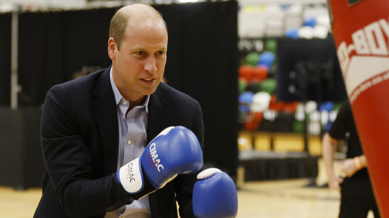 Prince William wears blue boxing gloves