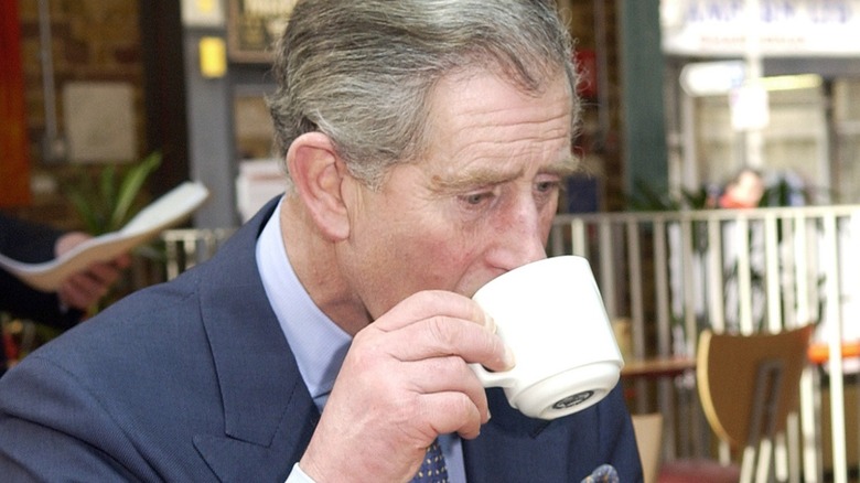 King Charles III drinking tea