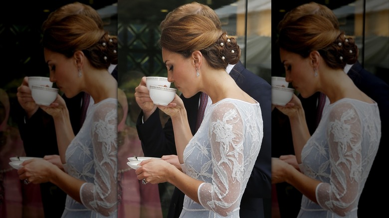 Catherine Princess of Wales sipping tea in a white dress