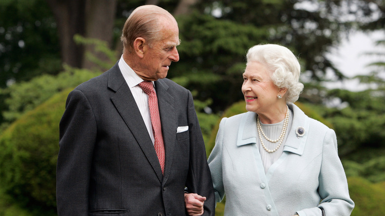 Prince Philip and the Queen gaze fondly at one another 