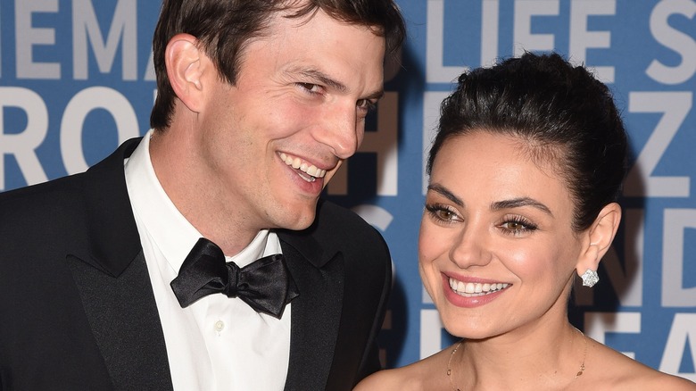 Ashton Kutcher and Mila Kunis smiling