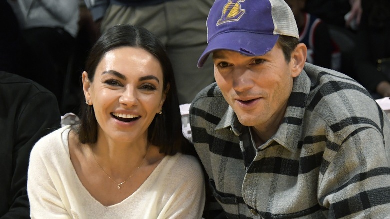 Mila Kunis and Ashton Kutcher smiling