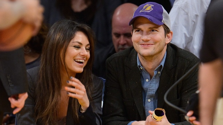 Mila Kunis and Ashton Kutcher laughing