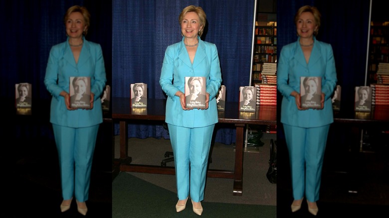 Hillary Clinton holding her book