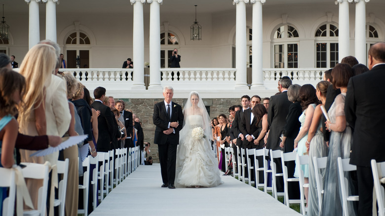 Bill and Chelsea Clinton walking down the aisle