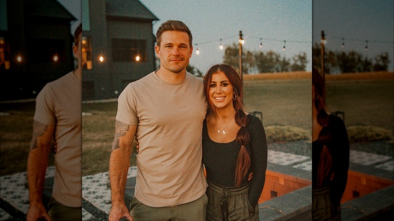 Cole and Chelsea DeBoer posing together outside