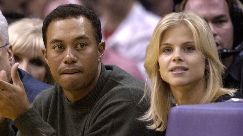 Tiger Woods and Elin Nordegren sitting together