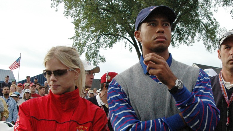 Elin Nordegren with Tiger Woods looking serious