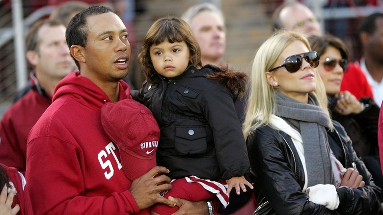 Tiger Woods and Elin Nordegren with their child