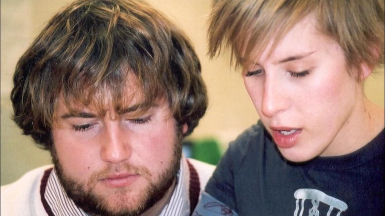 Young Ben Napier and Erin Napier looking down